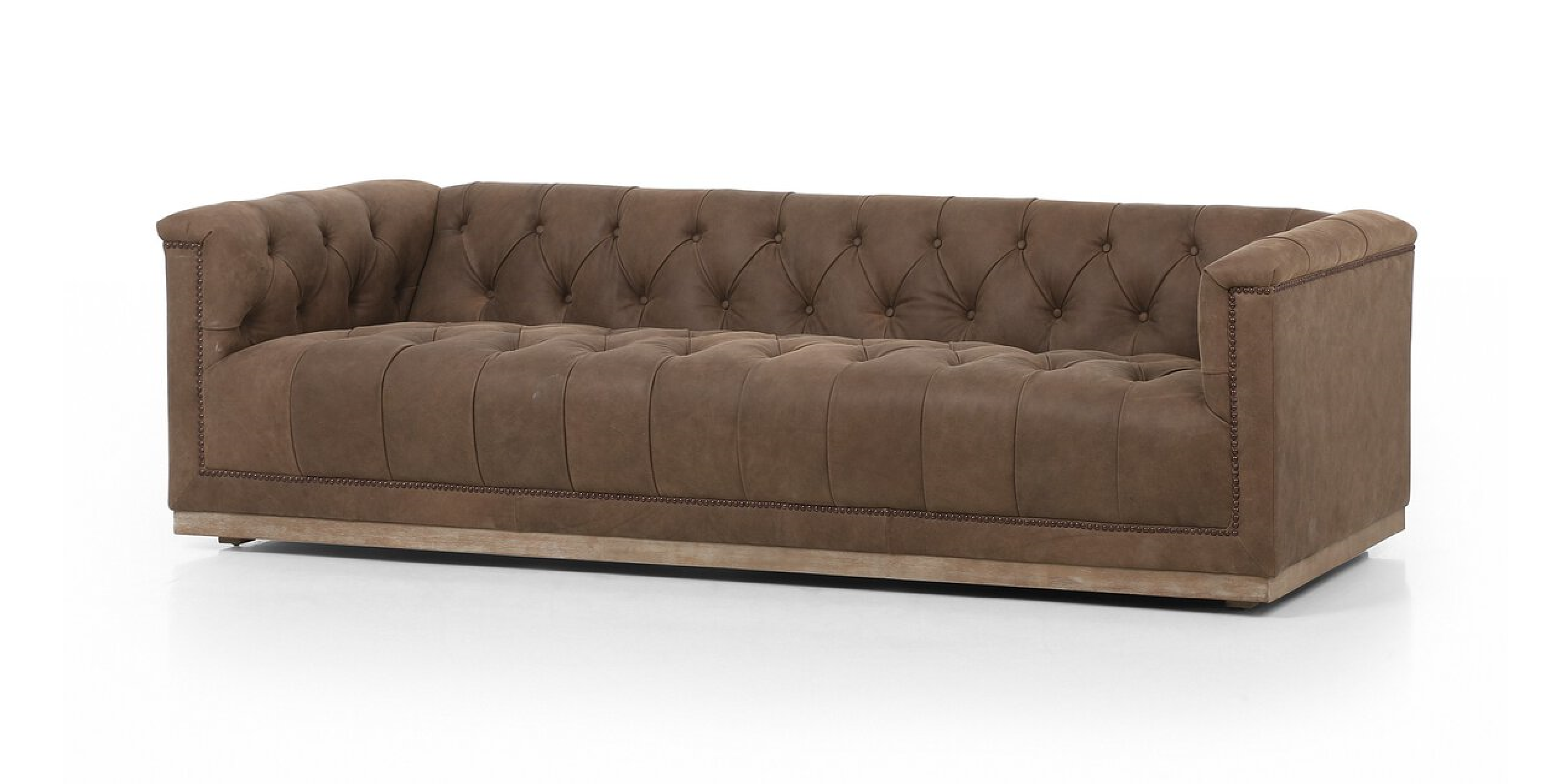 Stylish brown suede sofa with tufted design, perfect for modern and classic interiors.