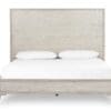 Minimalist wooden bed with a sleek headboard and storage drawer, perfect for modern bedrooms.