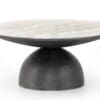Stylish modern coffee table with a unique stone top and matte black rounded base.