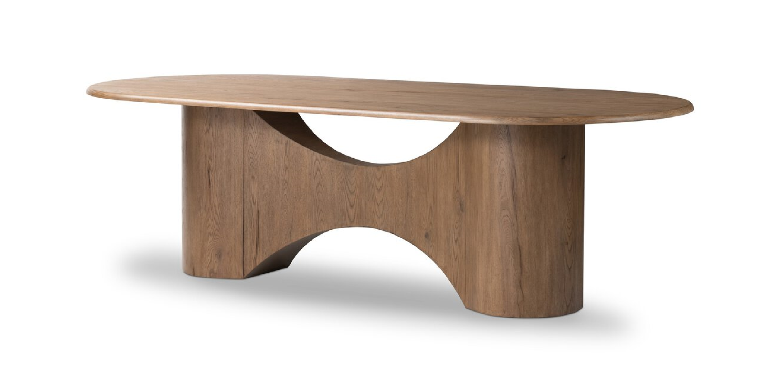 Sleek oval wooden table with sculptural legs, perfect for modern dining and stylish interiors.