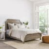 Cozy rustic bedroom retreat with natural light and inviting decor for ultimate relaxation.