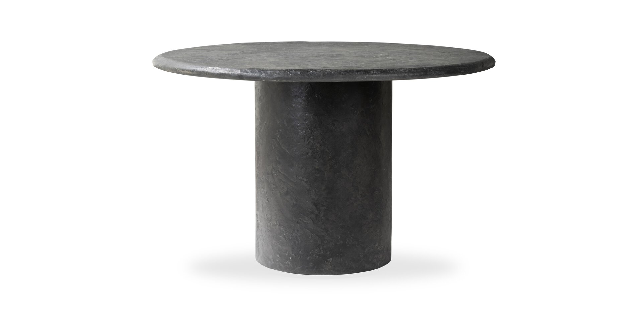 Sleek minimalist round table with a matte finish, perfect for modern interior decor.