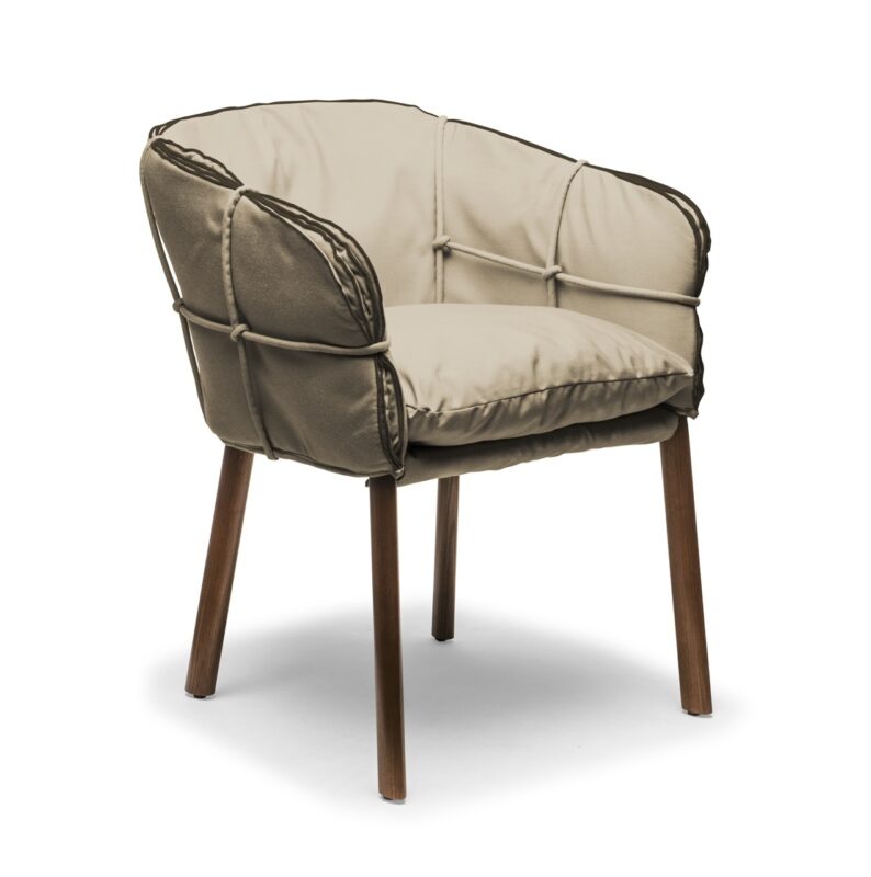 Contemporary beige accent chair with plush cushions and curved armrests for stylish home seating.