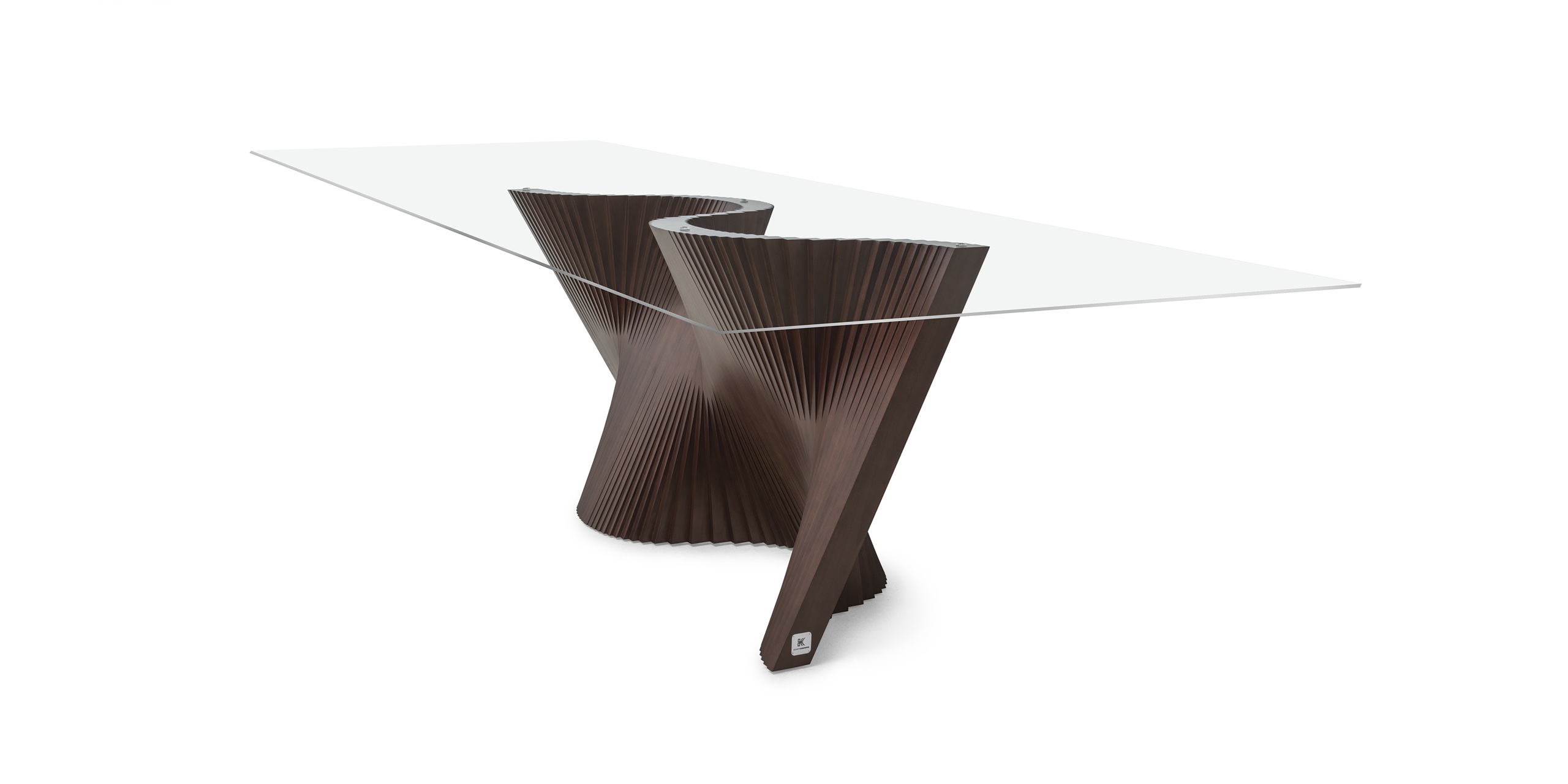 Sculptural glass dining table with a dark ribbed base, elegantly combining art and functionality.