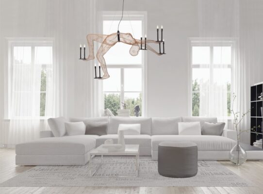 Minimalist living room with gray sofa and unique acrobat chandelier, combining comfort and modern style.