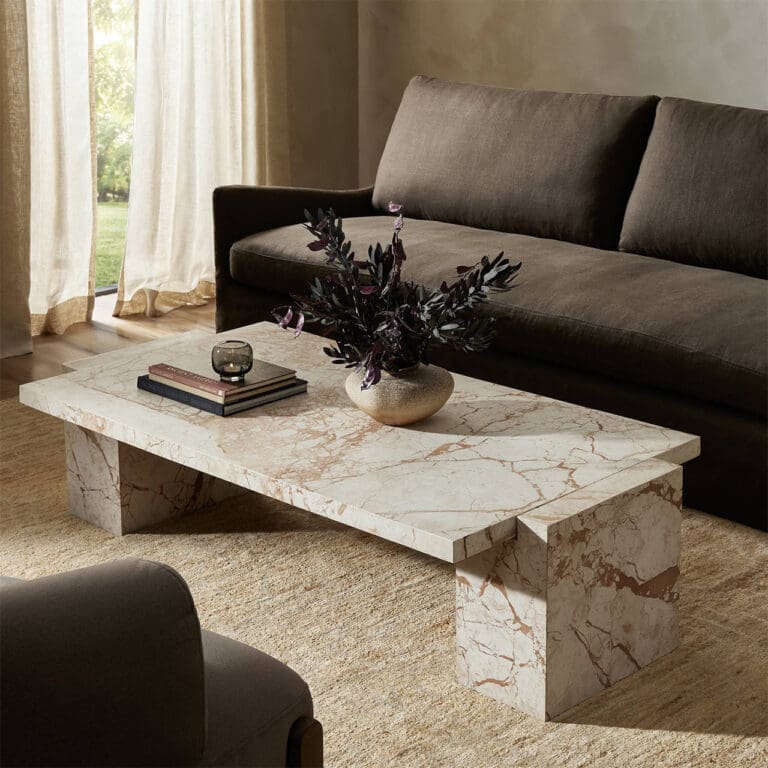 Modern living room featuring a chic marble coffee table and a cozy dark brown sofa.