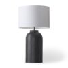 Sleek minimalist table lamp with textured dark base and white cylindrical shade for modern decor.