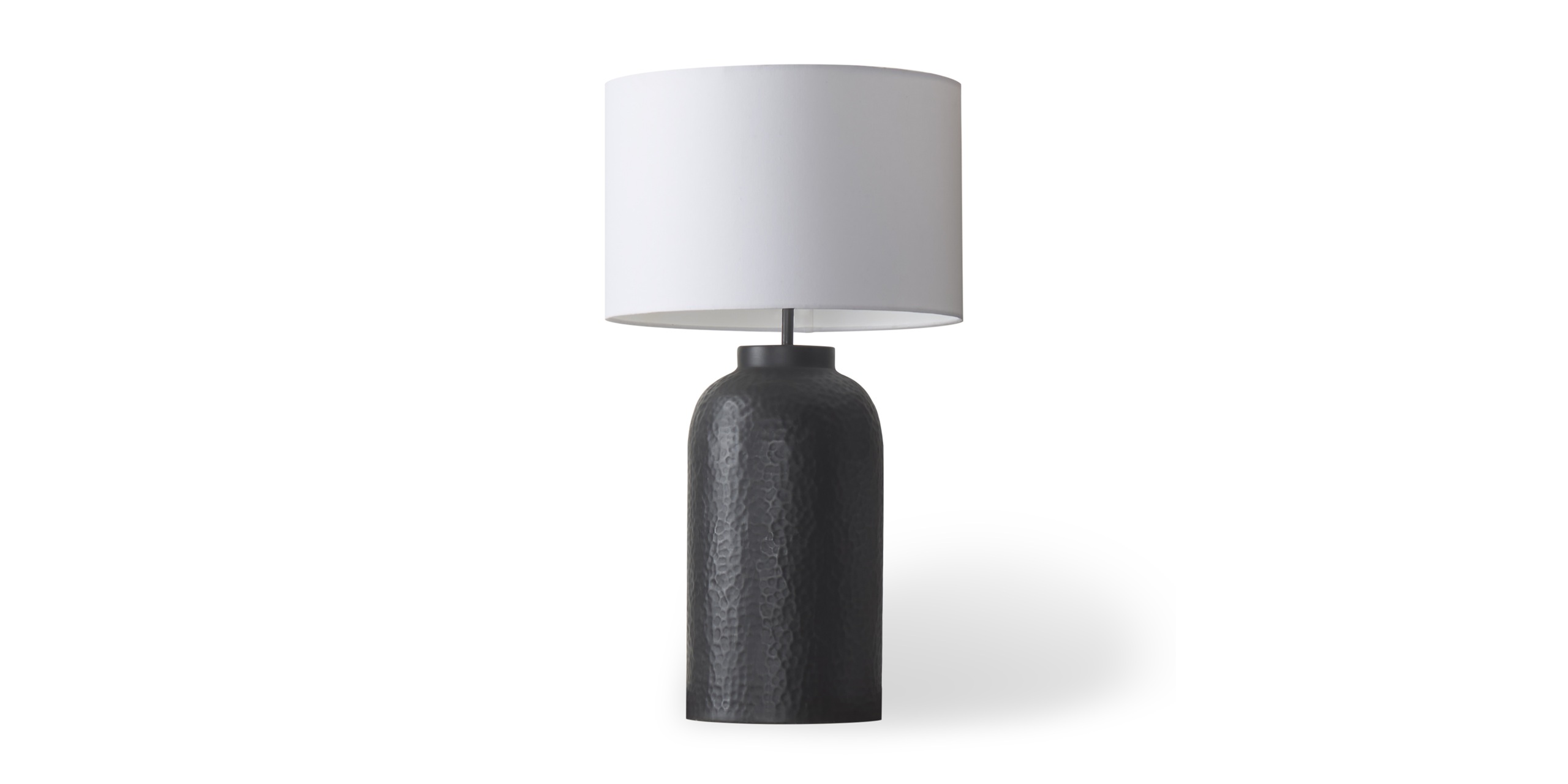 Sleek minimalist table lamp with textured dark base and white cylindrical shade for modern decor.
