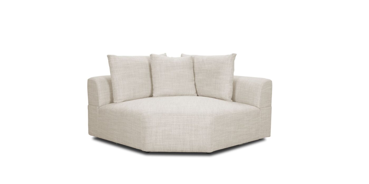 Stylish circular sofa with plush pillows, perfect for modern, cozy living spaces.
