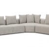 Contemporary L-shaped sectional sofa with plush pillows and elegant wood accents.