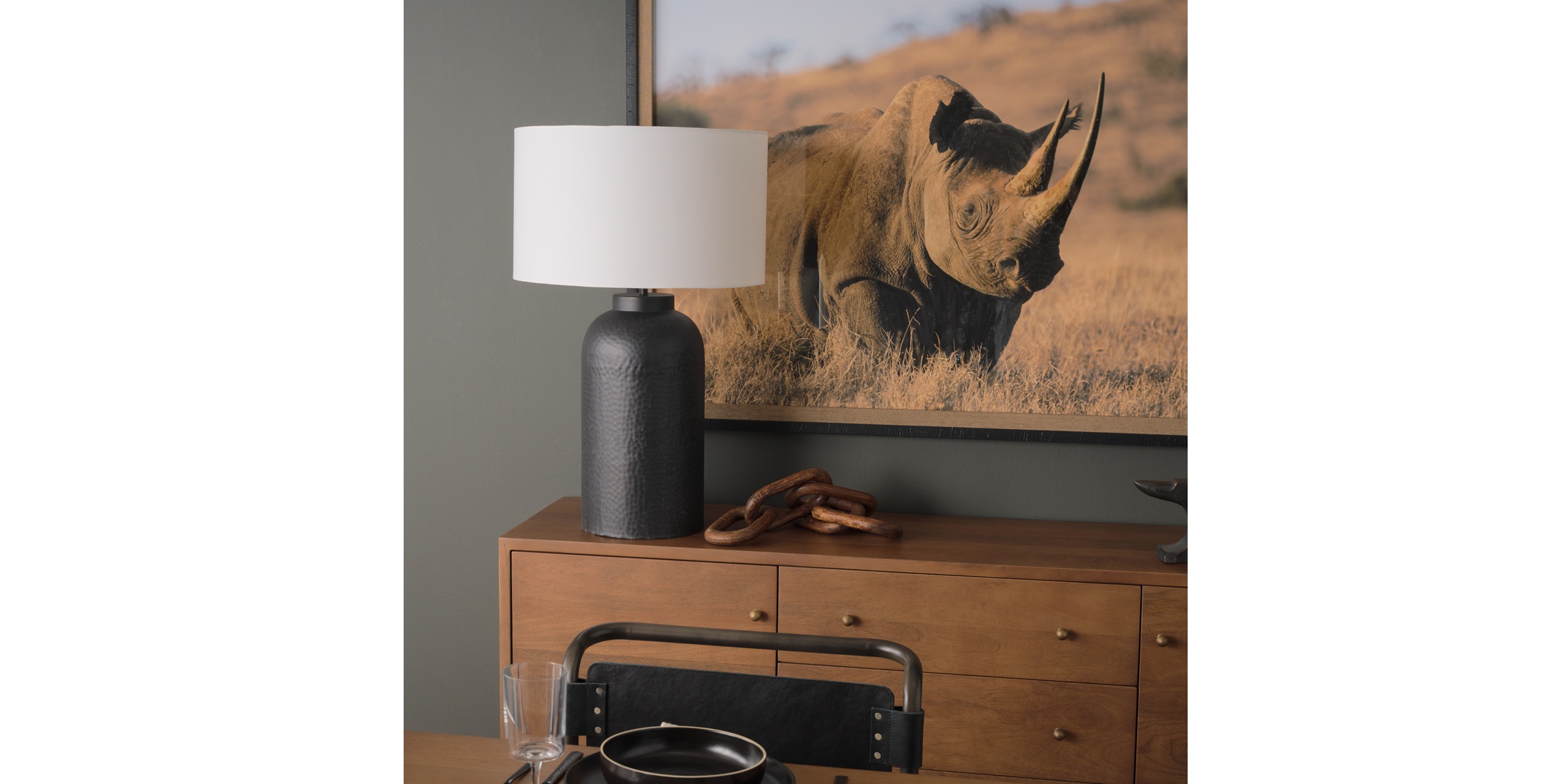 Stylish modern decor featuring wildlife art and natural elements in a warm, inviting setting.