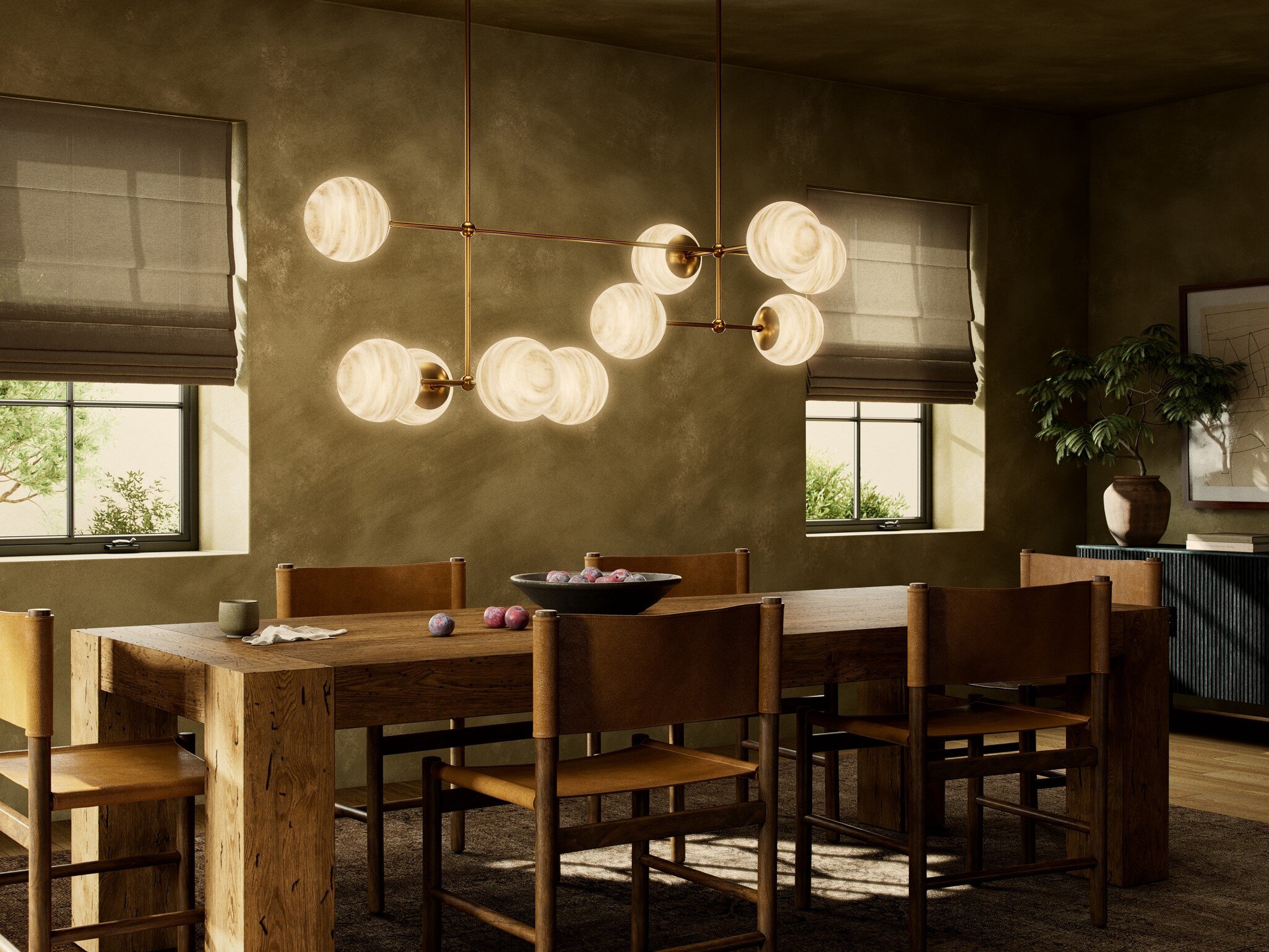 Heirloom-quality dining table with slipcovered chairs and artful pendant lighting creating an inviting gathering space at ARIID Home & Furniture